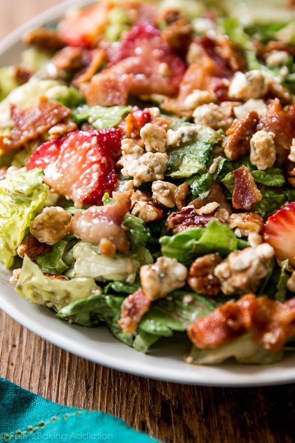 strawberry bacon salad on a white plate
