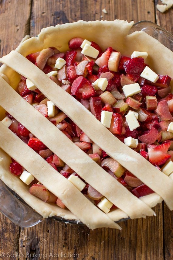 strawberry rhubarb pie with lattice pie dough on top