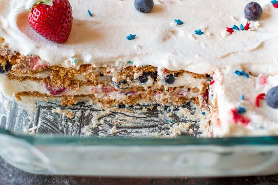 side view of berries & cream icebox cake in a glass baking dish