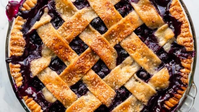 blueberry pie with lattice pie crust.