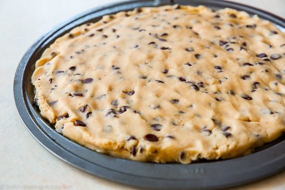 chocolate chip cookie dough pressed into pizza pan