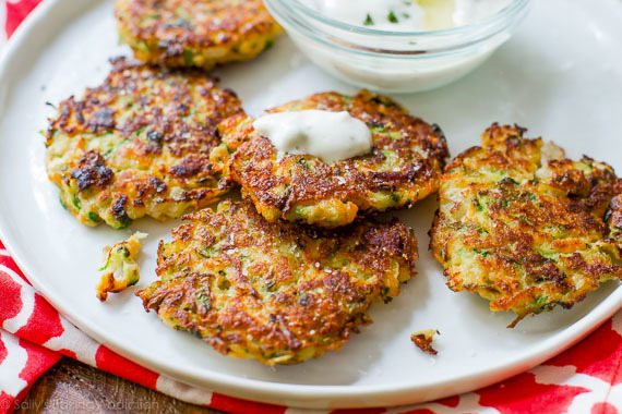 zucchini fritters on a white plate