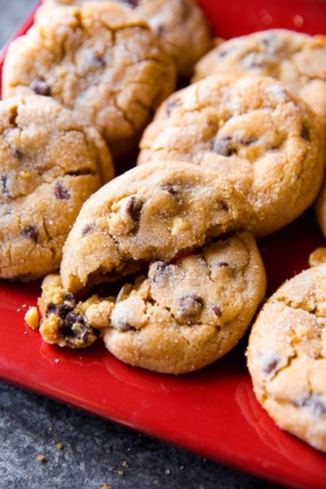 bakery-style peanut butter chunk cookies on a red serving plate