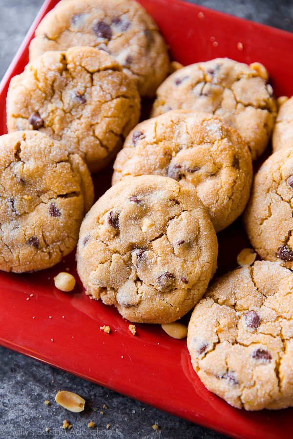 bakery-style peanut butter chunk cookies on a red serving plate