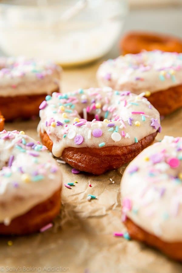 vanilla frosted doughnuts with sprinkles
