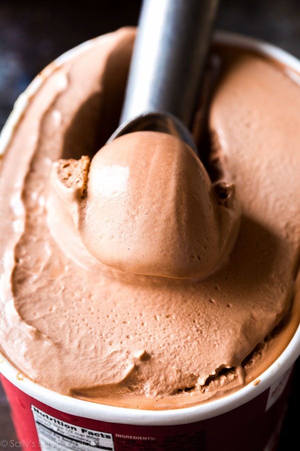carton of chocolate ice cream with ice cream scoop