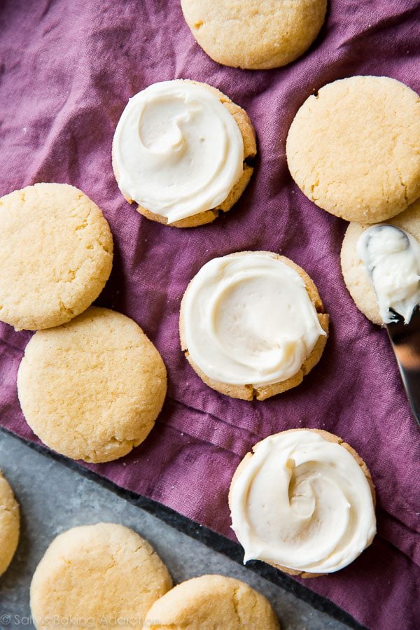 overhead image of cream cheese sugar cookies topped with cream cheese frosting