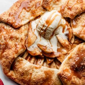 apple galette with vanilla ice cream and salted caramel on top.