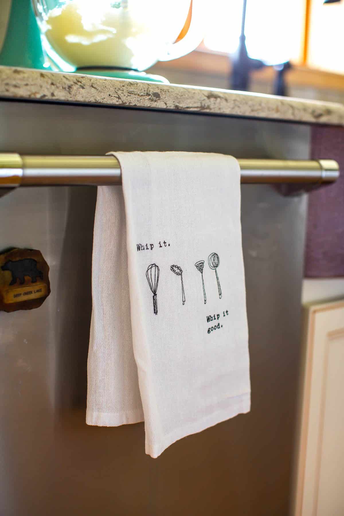 kitchen towel hanging on dishwasher handle