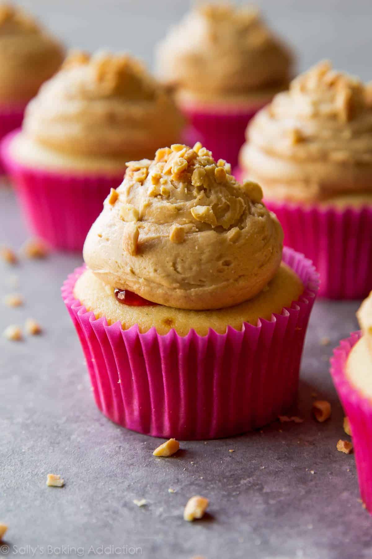 peanut butter and jelly cupcakes topped with peanut butter frosting