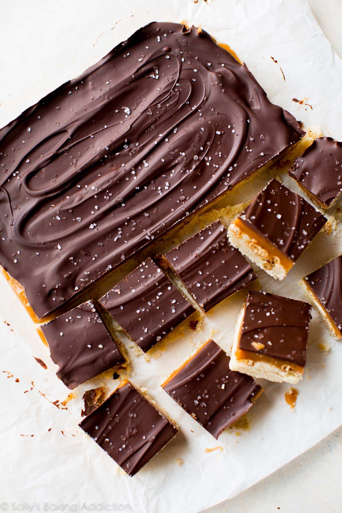 overhead image of salted caramel pretzel crunch bars with half cut into squares
