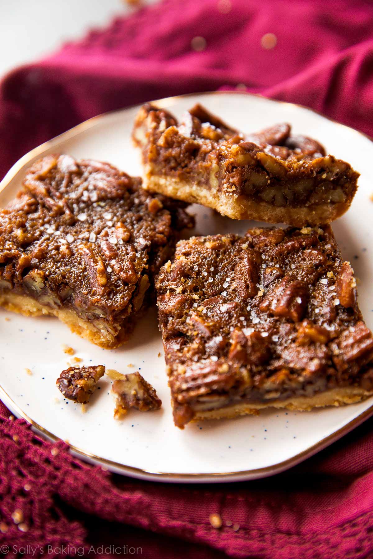 brown butter pecan pie bars on a white plate