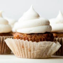Cream cheese frosting on carrot cake cupcake