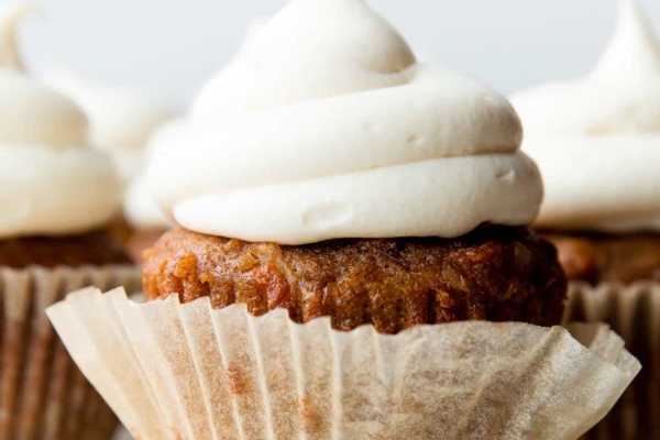 Cream cheese frosting on carrot cake cupcake