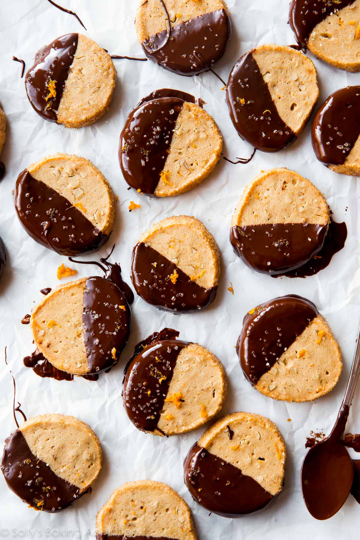 orange slice and bake cookies with half of each cookie dipped in dark chocolate