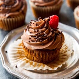 mocha Nutella cupcakes on a silver plate with Nutella frosting and chocolate sprinkles