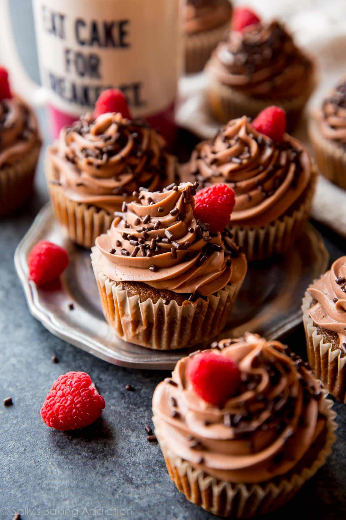 mocha Nutella cupcakes on a silver plate with Nutella frosting and chocolate sprinkles
