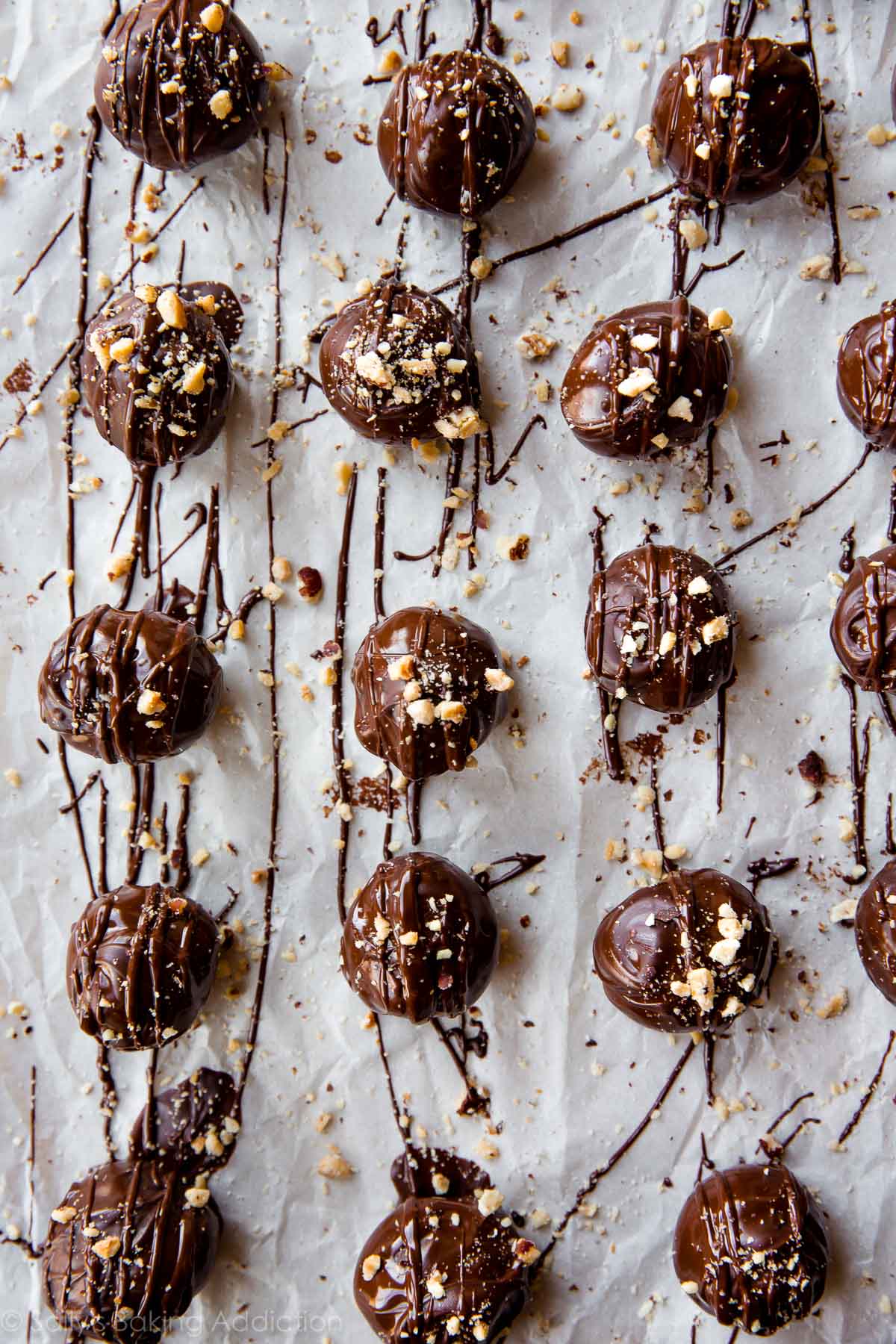 overhead image of chocolate hazelnut crunch truffles on parchment paper
