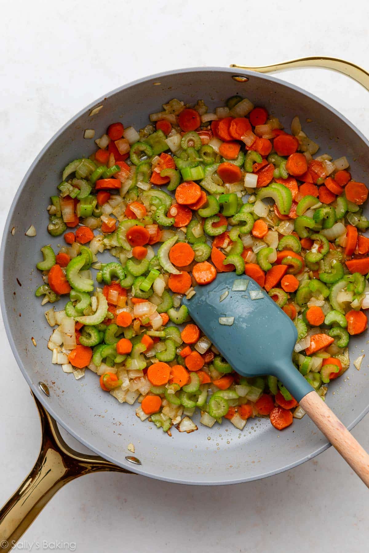 sautéed carrots, onion, and celery in skillet.