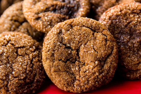 crisp molasses cookies on a red serving tray