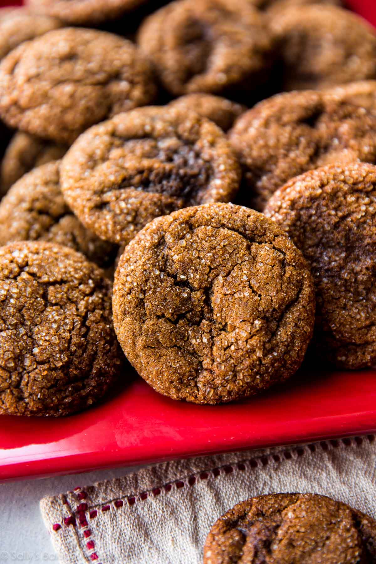 crisp molasses cookies on a red serving tray