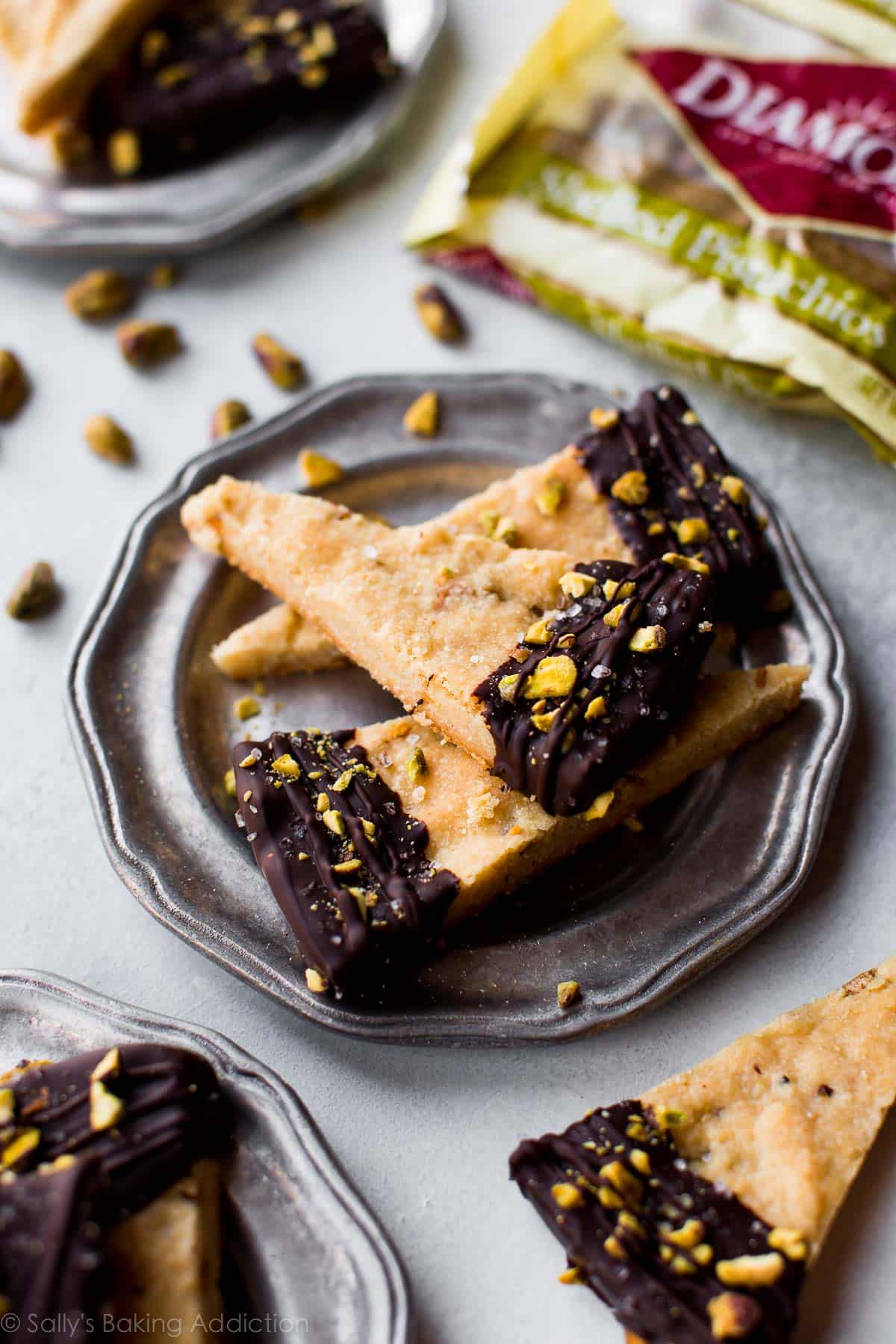 slices of salted chocolate pistachio shortbread on a silver plate