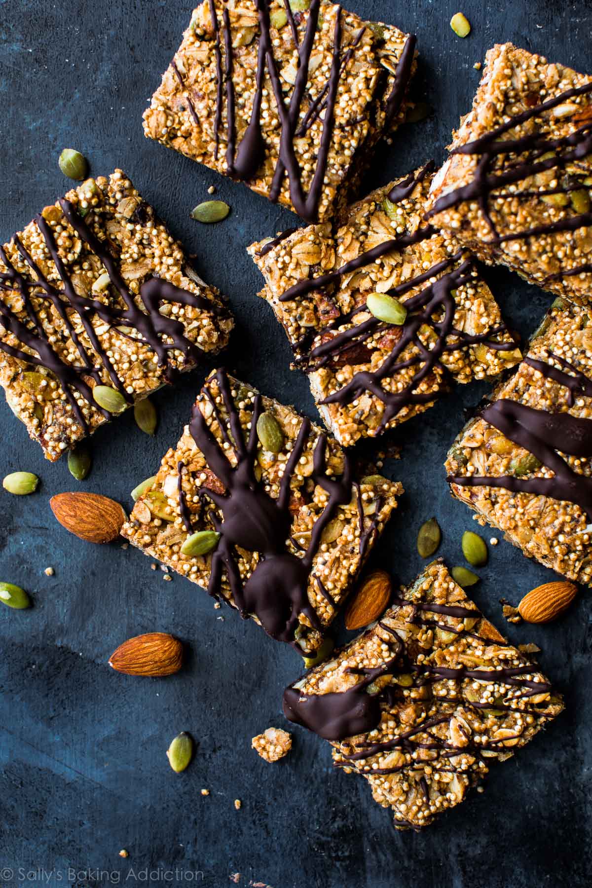 overhead image of quinoa crunch snack bars with drizzled chocolate on top