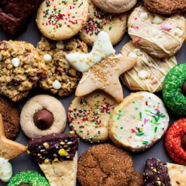 overhead image of a variety of Christmas cookies