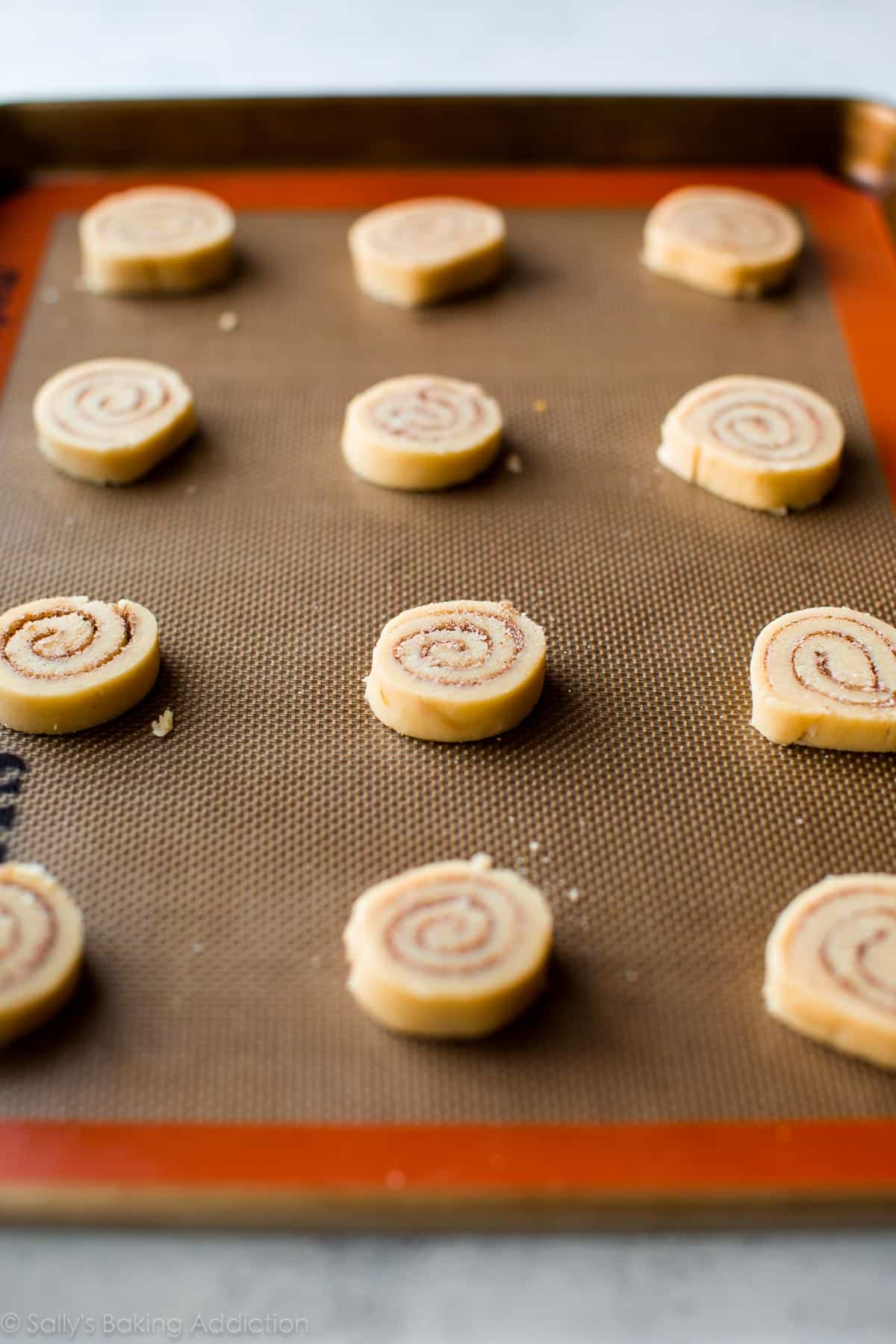 cinnamon roll cookie dough on baking sheet