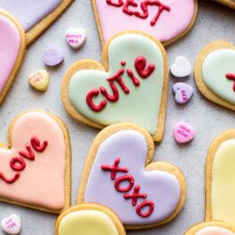 conversation heart sugar cookies decorated with colorful royal icing