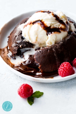 chocolate lava cake with a scoop of vanilla ice cream on a white plate