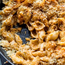 baked macaroni and cheese in a cast iron skillet