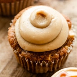 cupcake with piped salted caramel frosting on top.
