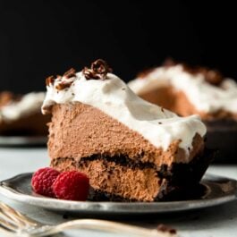 slice of chocolate mousse pie on a silver plate with a fork