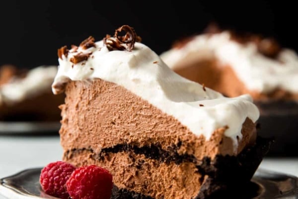 slice of chocolate mousse pie on a silver plate with a fork