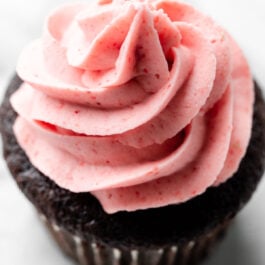 chocolate cupcake with strawberry buttercream frosting.