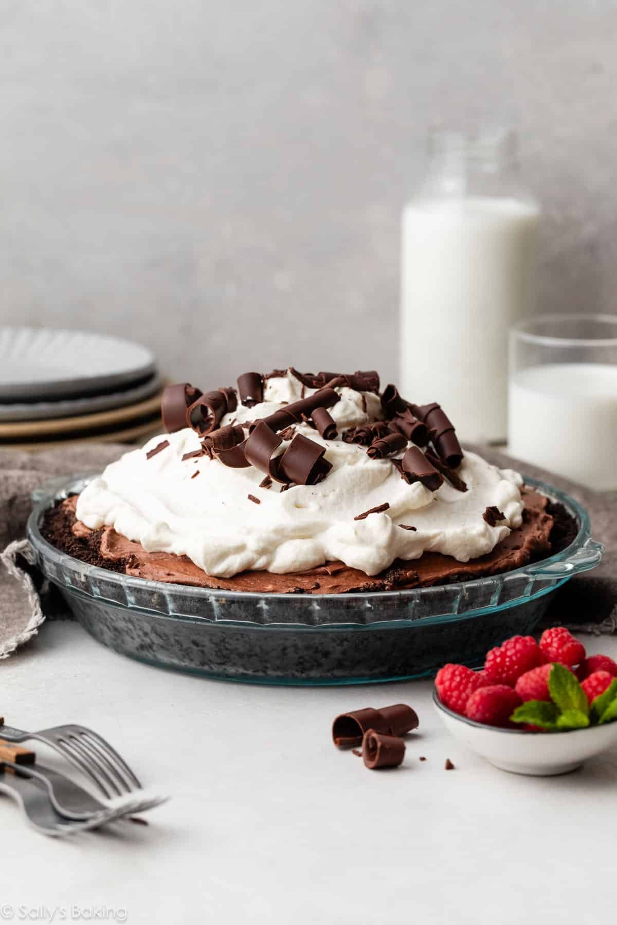 chocolate mousse pie with whipped cream and chocolate curls.