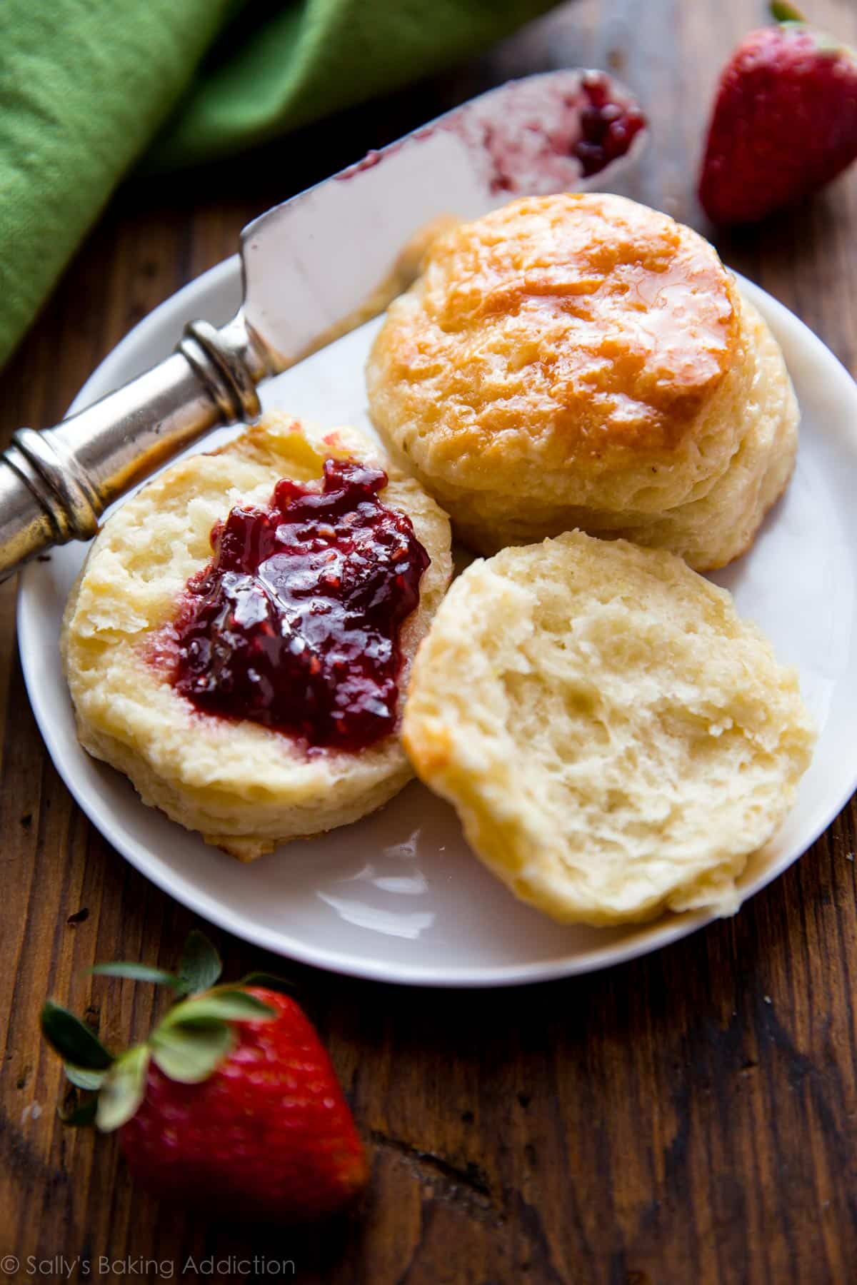 Biscuits and jam on a white plate