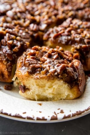 maple pecan sticky buns on a white serving tray