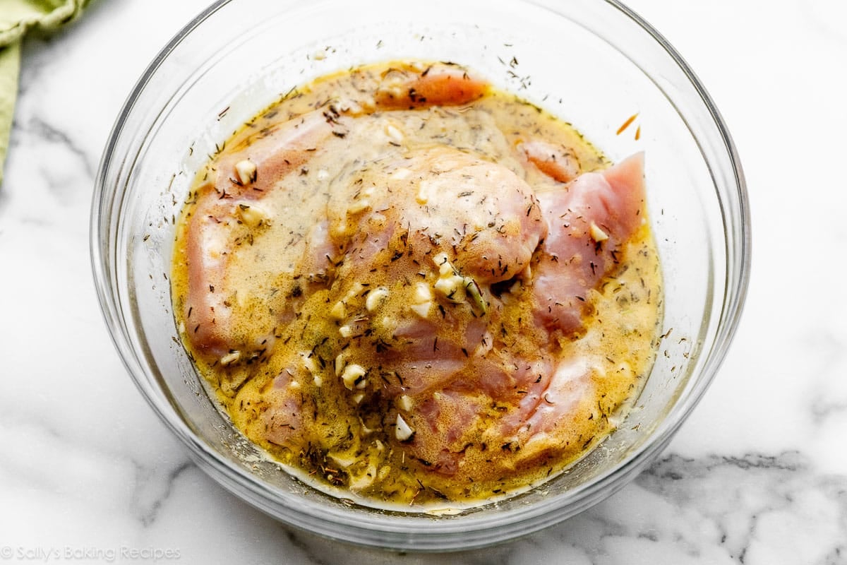 marinating chicken in olive oil, garlic, thyme, mustard, and wine.