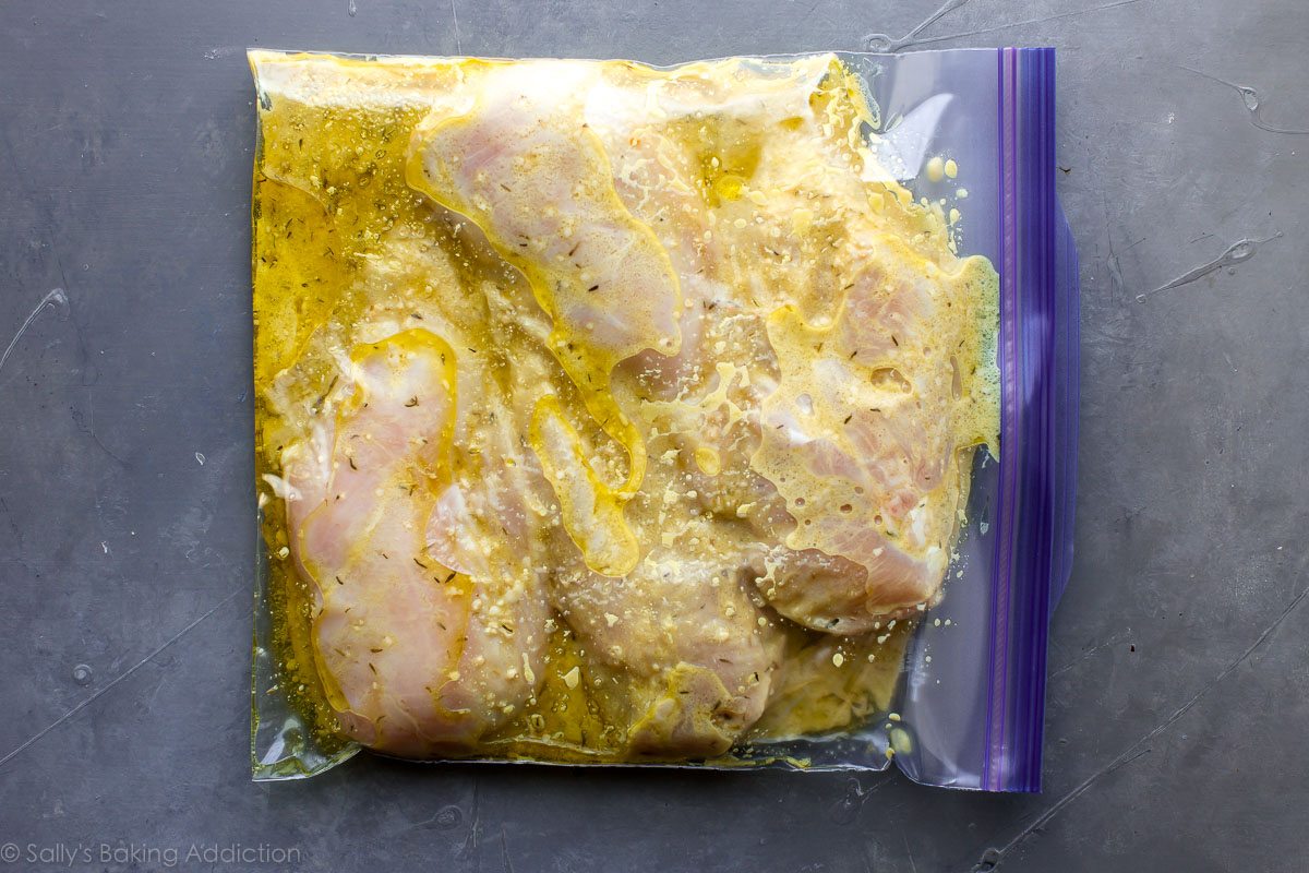 chicken marinating in a plastic bag