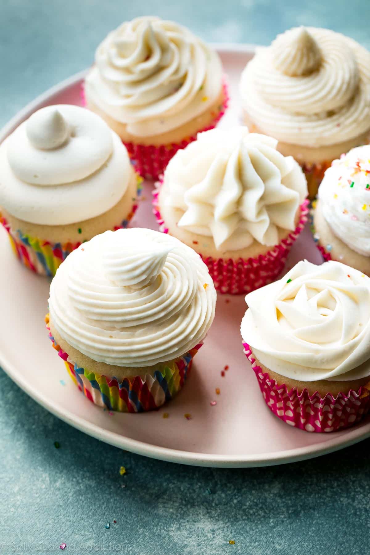 cupcakes decorated with vanilla buttercream using various piping tips
