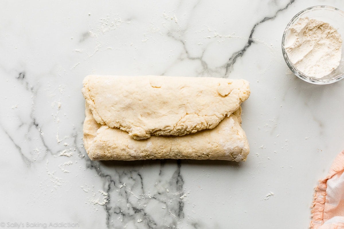 folded dough on marble counter