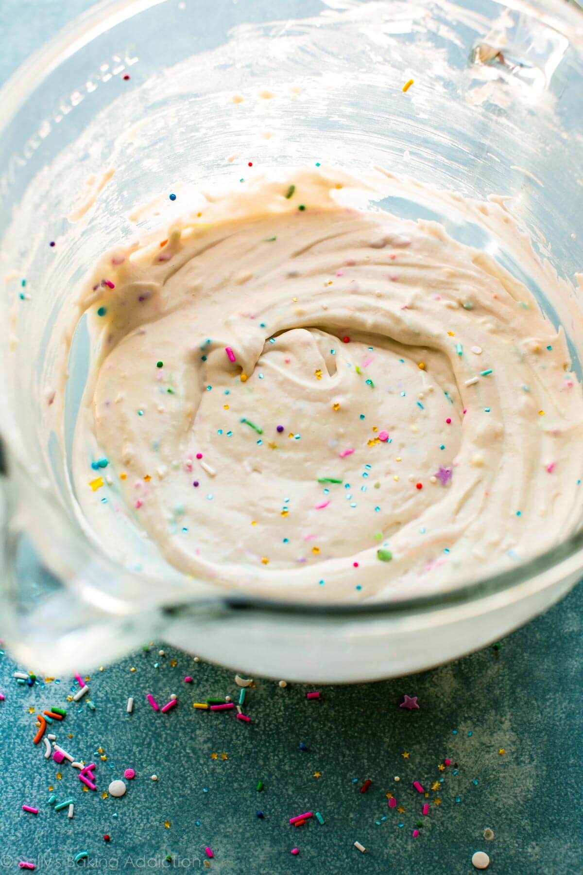 sprinkle cupcake batter in a glass bowl