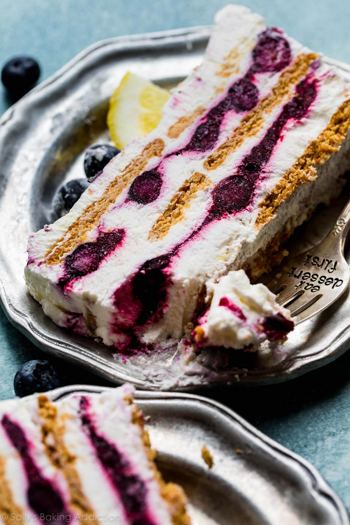 slice of blueberry lemon icebox cake on a silver plate with a fork