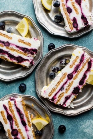 slices of blueberry lemon icebox cake on silver plates