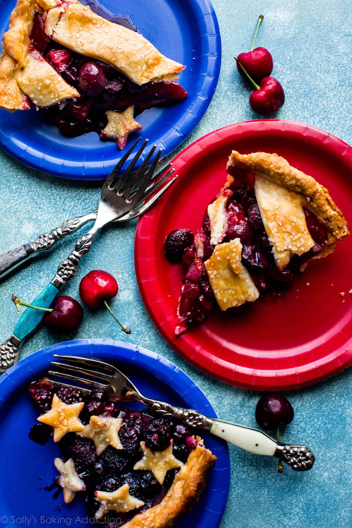 slices of American flag pie on red and blue plates
