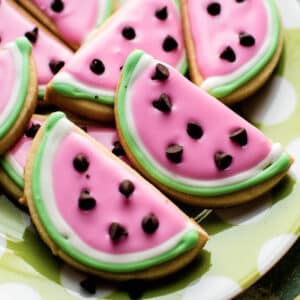 close-up image of watermelon-looking sugar cookies with colorful royal icing.