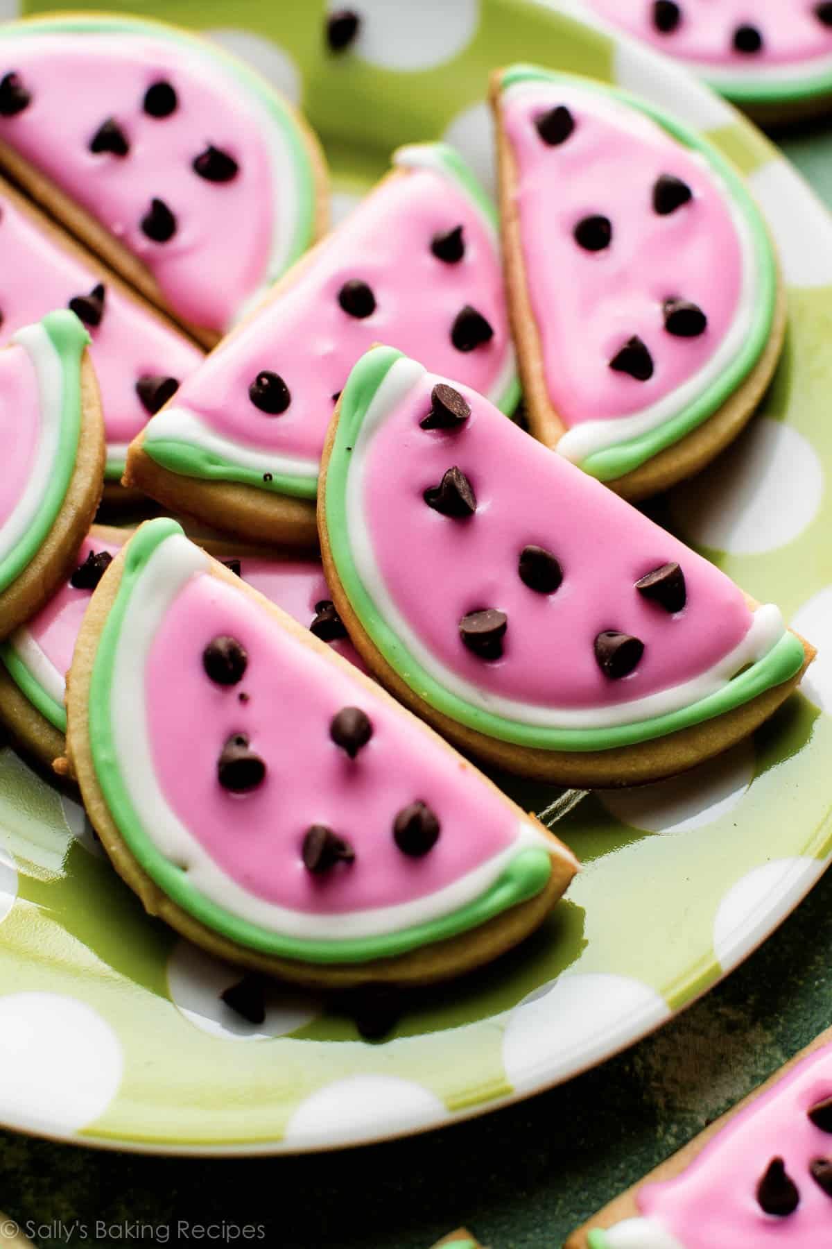 close-up image of watermelon-looking sugar cookies with colorful royal icing.