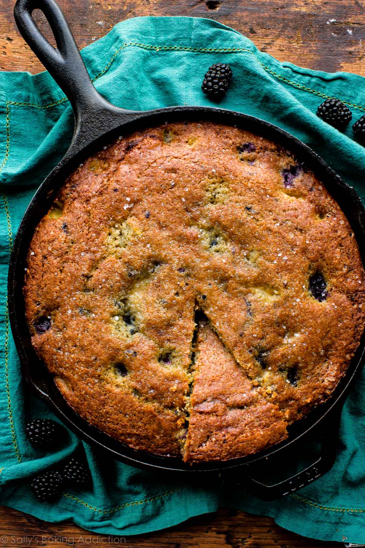 blackberry peach skillet cornmeal cake in a skillet after baking without icing